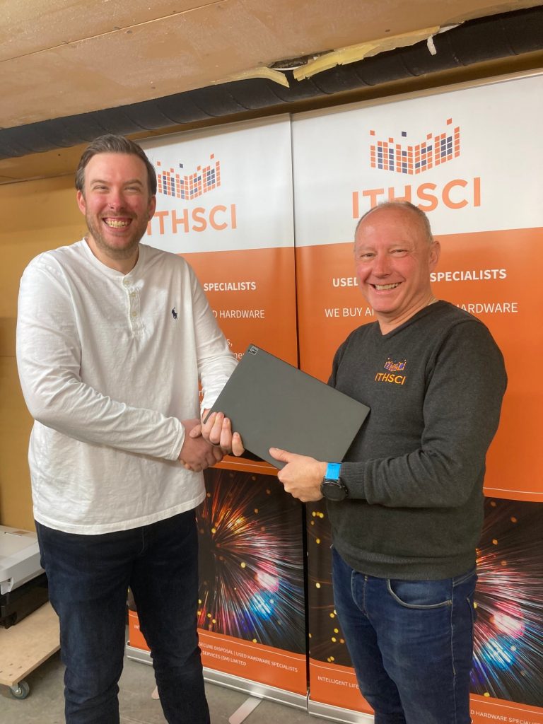 Kevin Alway receiving laptop donation for Macmillan Jersey