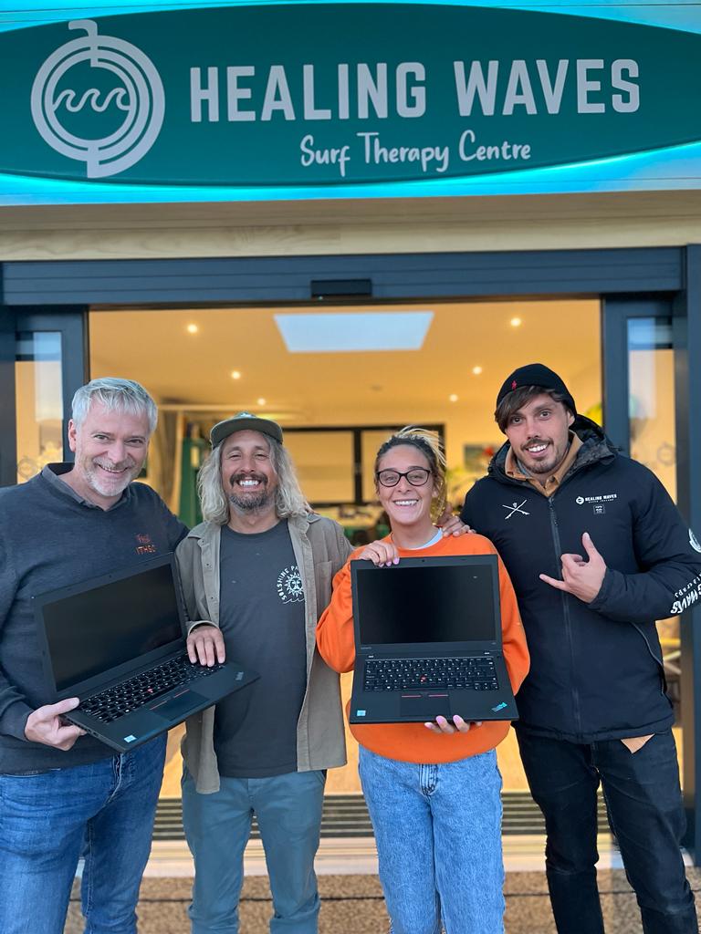 Healing Waves representatives collecting laptop donations from ITHSCI